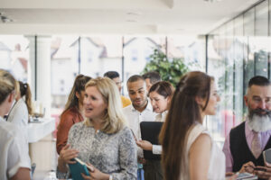 People networking in a formal setting.